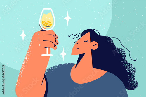 Smiling woman hold glass with drink 