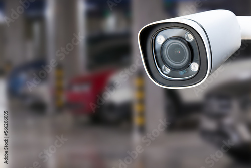 CCTV camera in underground parking garage. Copy space.