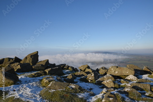 a view from the top of Clee hill on a foggy day where the fog has settled in the valley