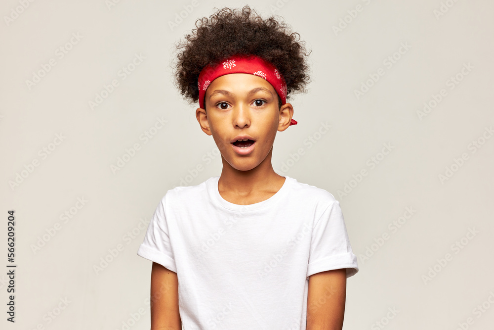 Portrait of shocked and astonished surprised african american male kid