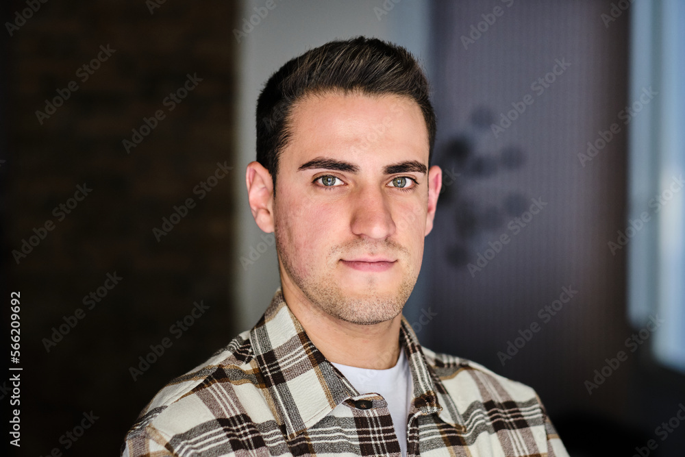 © Cavan Images - Portrait if a young man at home looking at camera. © Cavan Images - Portrait if a young man at home looking at camera.