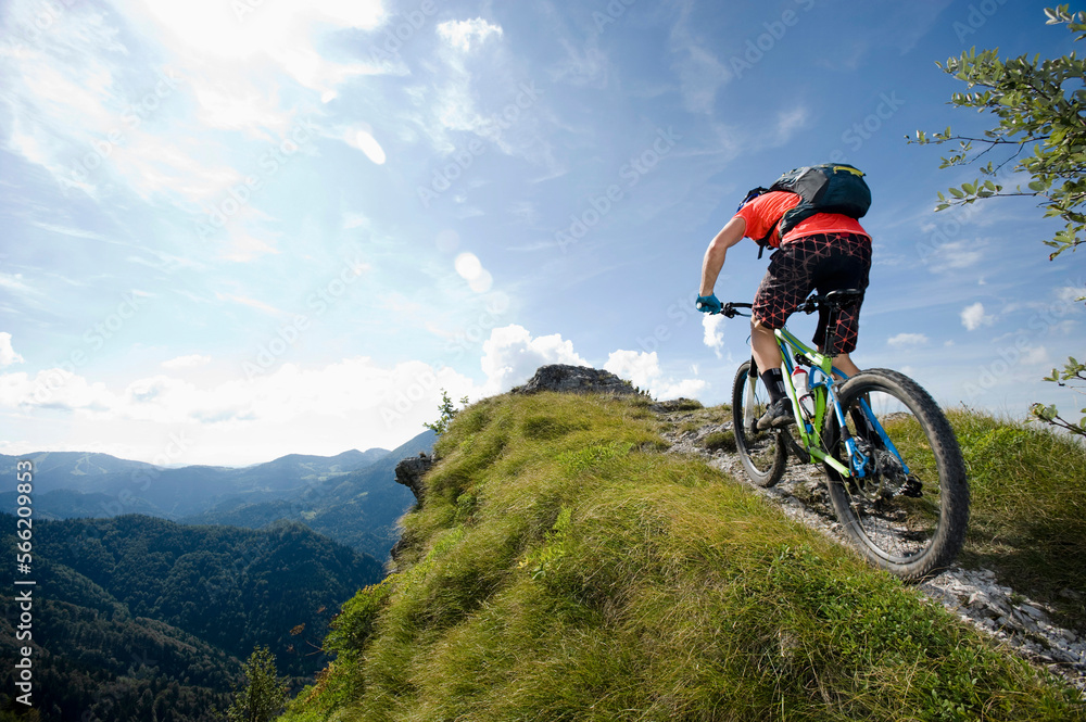 mountain biker on the way uphill, Slatnik, Istria, Slovenia mountain biker on the way uphill, Slatnik, Istria, Slovenia