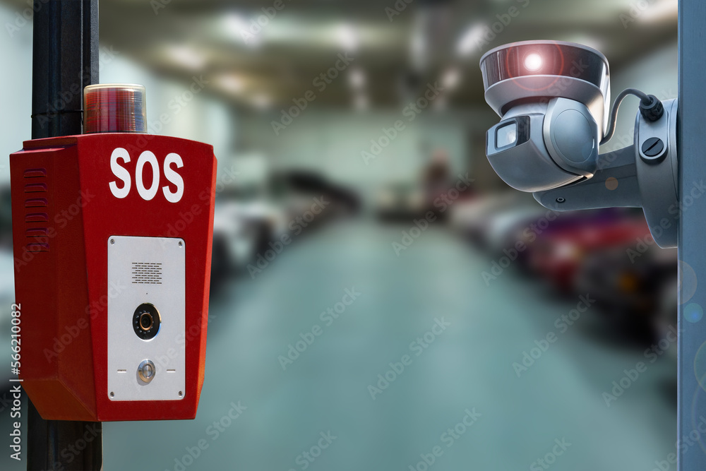 Fototapeta premium CCTV security camera on blur car parking.Parking security system.