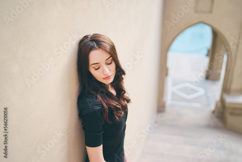 Outdoor portrait of beautiful sensual young woman with long dark hair.