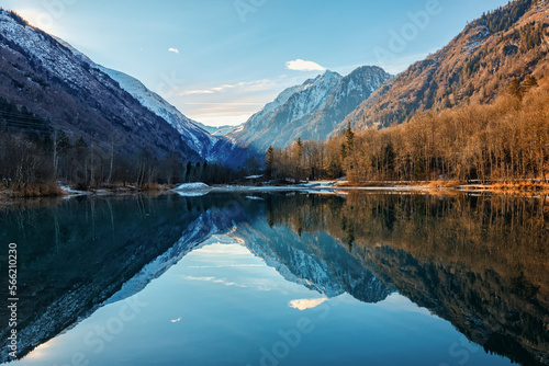 Tablou pe pânză Mountain lake with water reflections at morning light