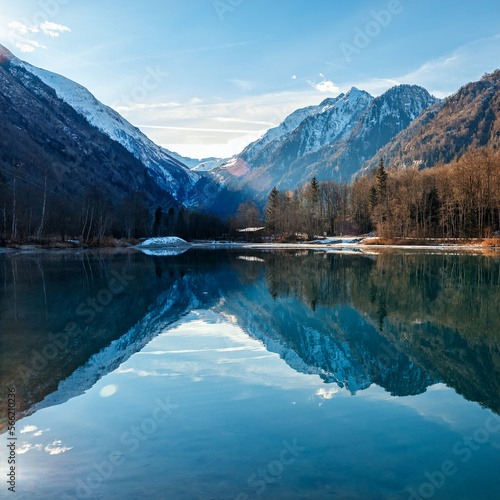 Mountain lake with water reflections at morning light. Salzburg country.