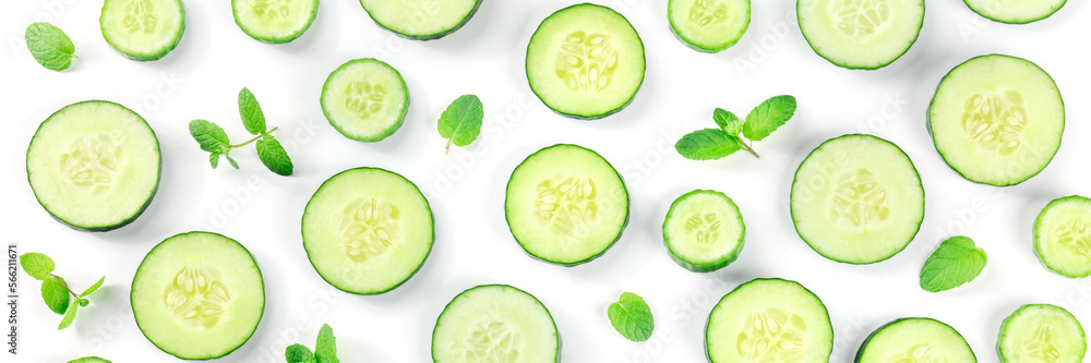 Fresh cucumber slices and mint leaves on a white background panorama, shot from above. Healthy organic food pattern Fresh cucumber slices and mint leaves on a white background panorama, shot from above. Healthy organic food pattern