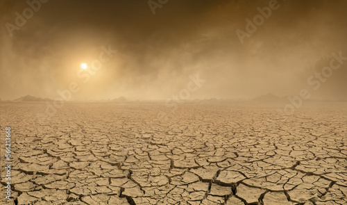 Fotografia Panorama of arid barren land with cracked soil and sun barely visible through the approaching sand storm
