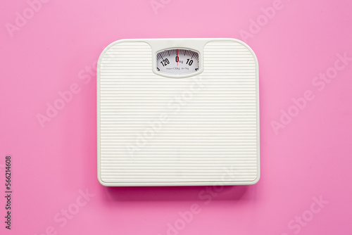 White weight scales on the floor. Weight measurement and loss concept