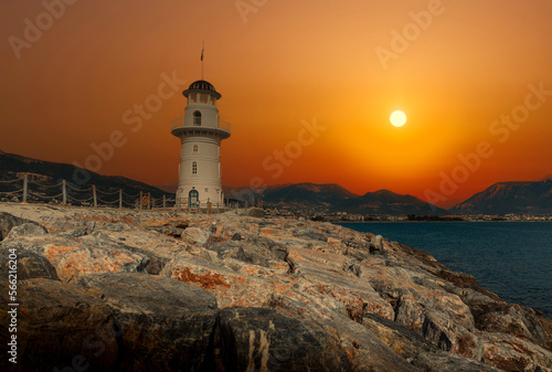 Lighthouse at sunset. Mediterranean sea. photo