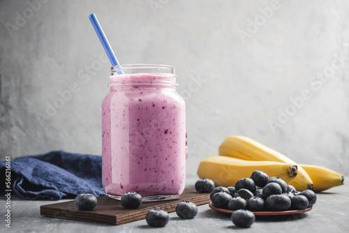 Blueberry and banana smoothie drink in a glass jar, healthy eating concept