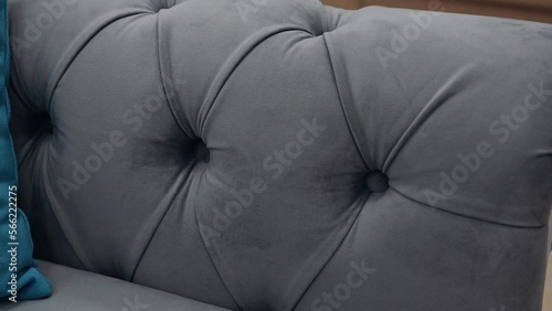 Close-up of a comfortable gray sofa. 4k video.