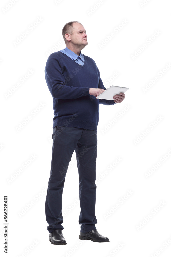in full growth. serious man with a digital tablet. in full growth. serious man with a digital tablet.