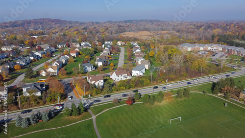 Pars side upscale suburban residential neighborhood row of two-story houses, Pinnacle Hill background in Rochester, Upstate New York