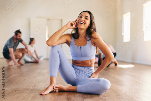 Woman laughing in a yoga studio