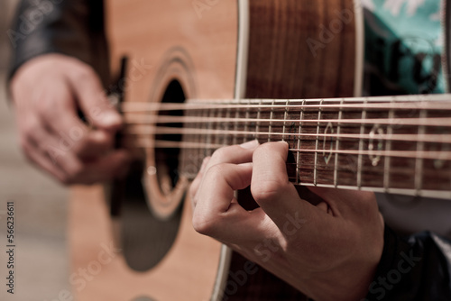 Photography Musician's Hands Playing Acoustic Guitar, Passionate Practice Session folk or ro