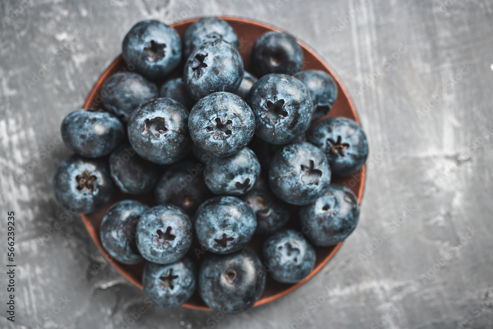 Fresh blueberries in a plate on a table, top view Fresh blueberries in a plate on a table, top view