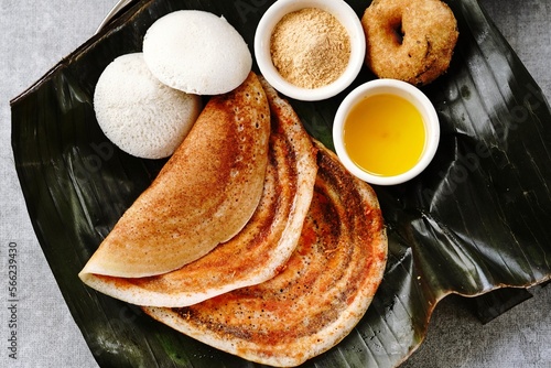 South Indian vegetarian breakfast idli karam podi dosa sambar chutney powder ghee and filter coffee photo