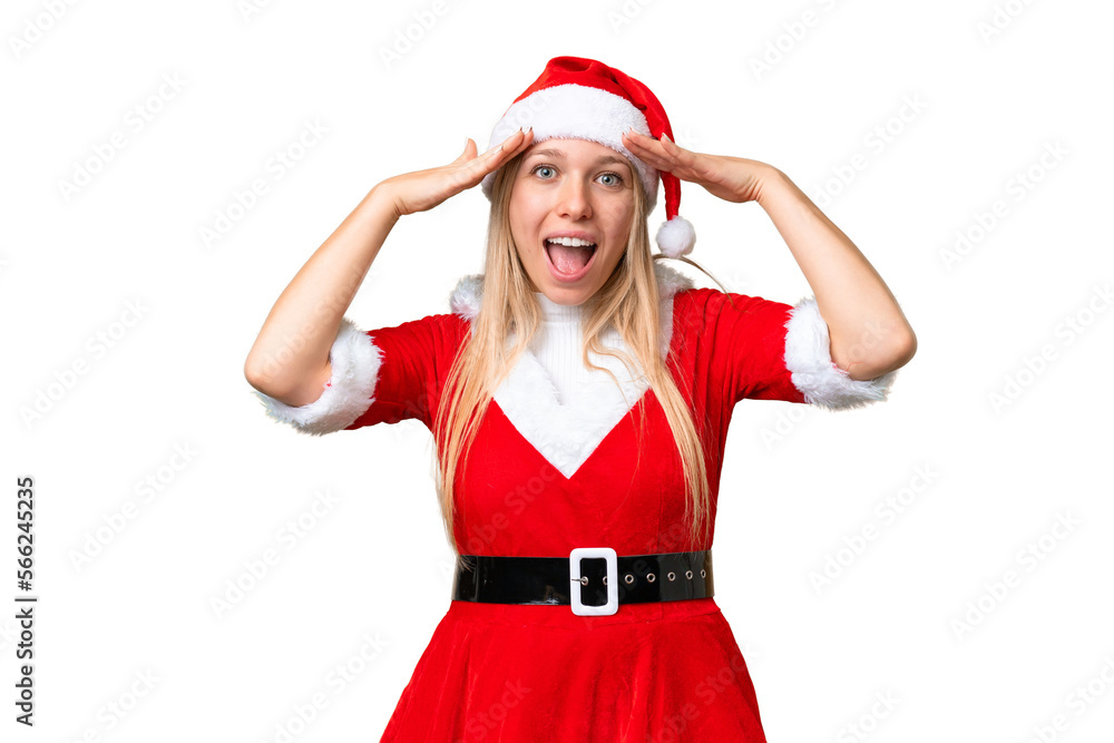 Young blonde woman with christmas hat over isolated chroma key background with surprise expression Young blonde woman with christmas hat over isolated chroma key background with surprise expression