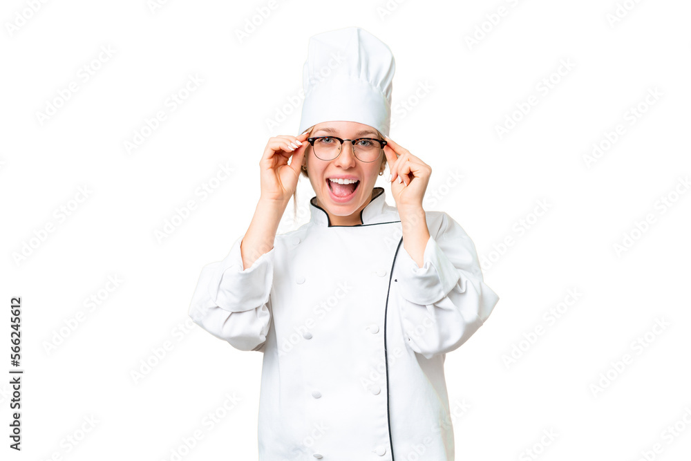 Young chef woman over isolated chroma key background with glasses and surprised Young chef woman over isolated chroma key background with glasses and surprised