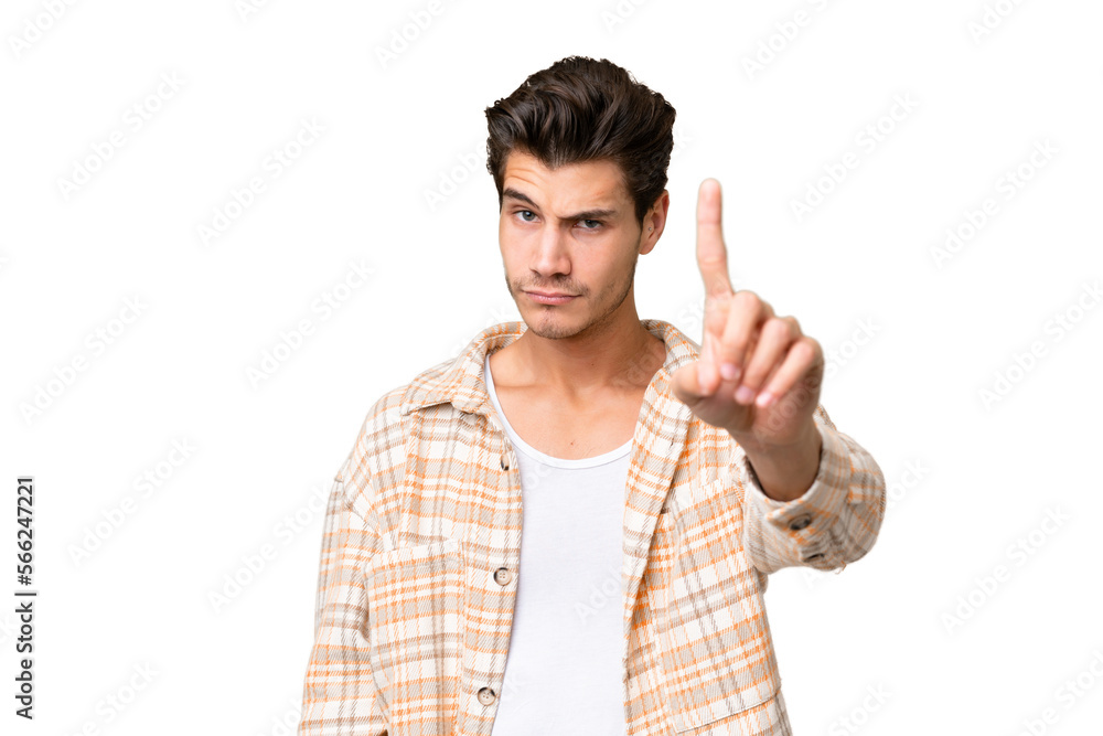 Young handsome caucasian man over isolated background counting one with serious expression Young handsome caucasian man over isolated background counting one with serious expression