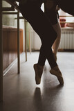 legs of ballet dancer in ballet pose in a class, vintage image, copy space