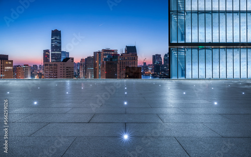 Empty square floor and city skyline with modern building at sunrise in Shanghai  China.