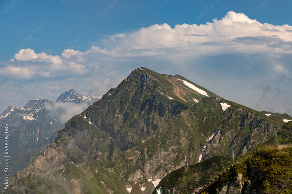 Russia, Sochi, Krasnaya Polyana. Summer landscapes of the Caucasus mountains in Rosa Khutor. View of the peaks of the mountains