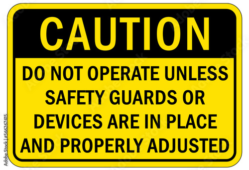 Machine guarding sign and labels do not operate unless safety guards or device are in place and properly adjusted