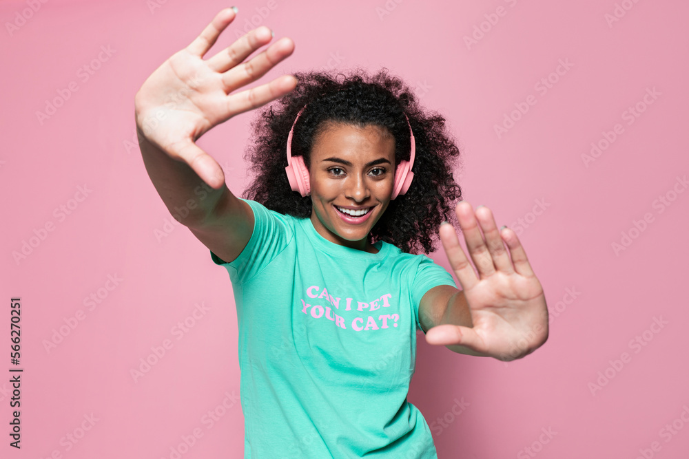 Cheerful black woman showing stop gesture in studio Cheerful black woman showing stop gesture in studio