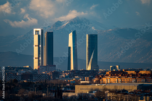 City of Madrid with the towers of Castellana street and the Navacerrada mountain with snow.