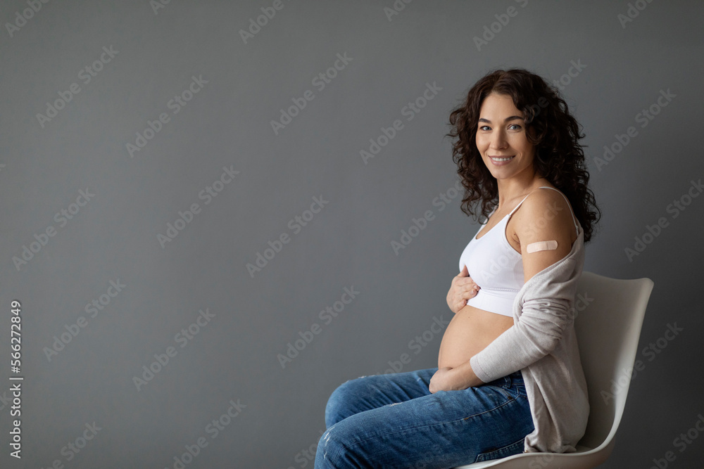 Portrait Of Smiling Young Pregnant Woman Posing After Coronavirus Vaccination Portrait Of Smiling Young Pregnant Woman Posing After Coronavirus Vaccination