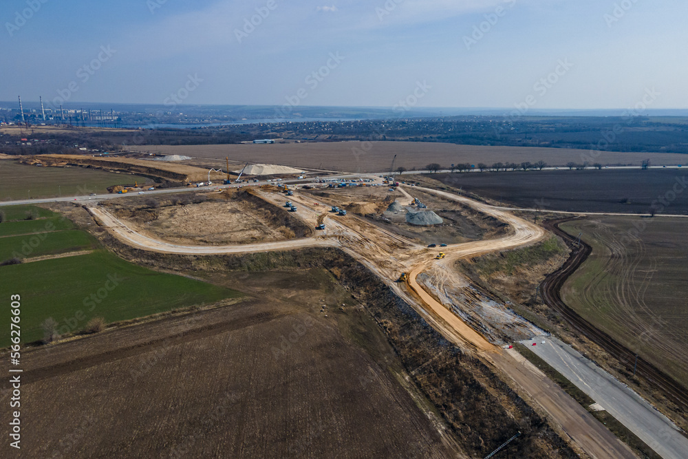 
Road construction. New section of the road. Top view of the construction of transport interchanges in the region. heavy machinery