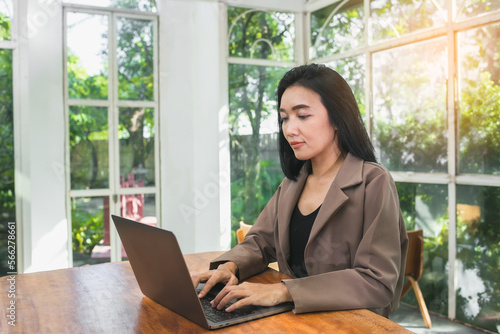Young beautiful Asian woman working with laptop used the internet and shopped online, freelancer working businesswoman lifestyle concept © PayonGrahy
