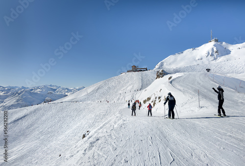 Skiers and snowboarders on the top station of Courchevel and Meribel slopes, France.
