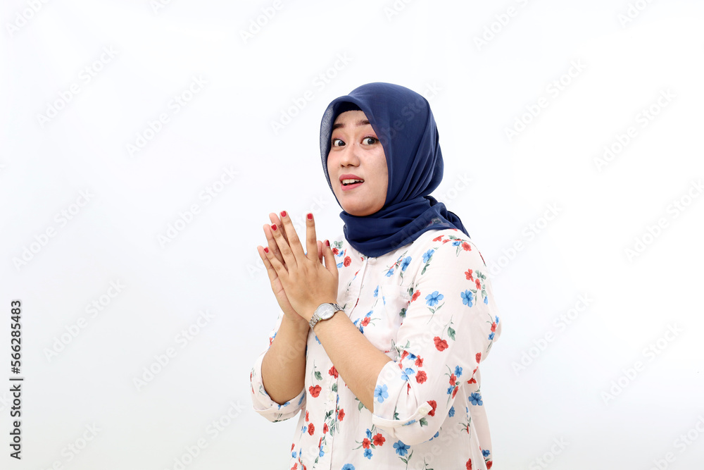 Amazed asian muslim woman standing while looking at the camera. Isolated on white background Amazed asian muslim woman standing while looking at the camera. Isolated on white background