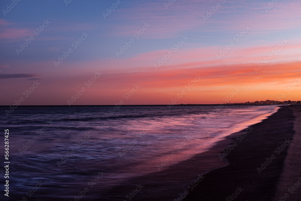 Moody calm sea landscape with long exposure water movement and waves and colorful amazing sky and horizon. Ocean in sunrise or sunset sunlight. Concept of travel nature destination Moody calm sea landscape with long exposure water movement and waves and colorful amazing sky and horizon. Ocean in sunrise or sunset sunlight. Concept of travel nature destination
