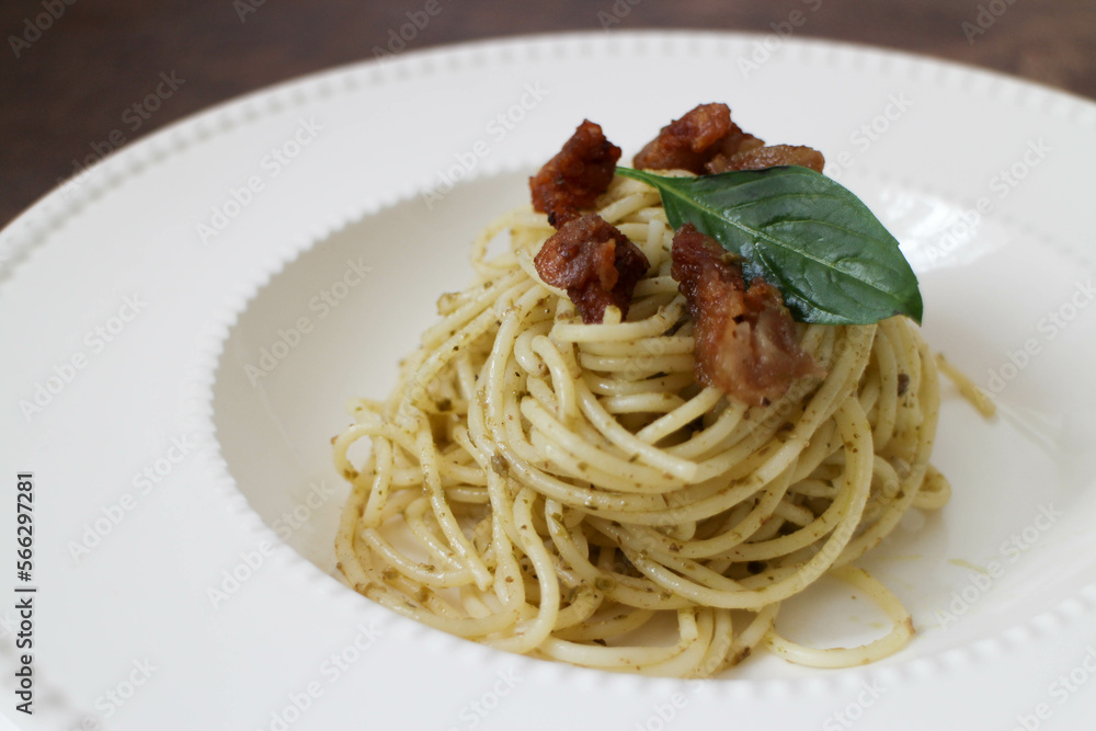 Close up Pesto Spaghetti on White Background Close up Pesto Spaghetti on White Background