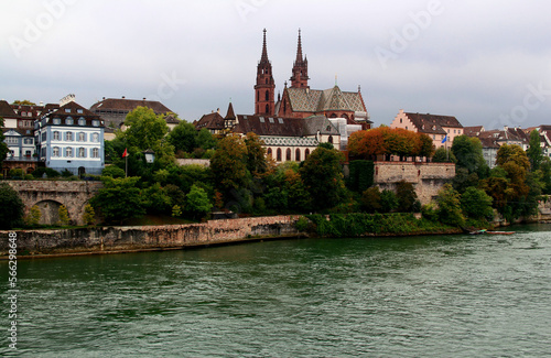 View of the Gothic red brick Basel Cathedral and the embankment of the Rhein River in the city of Basel, northern Switzerland 