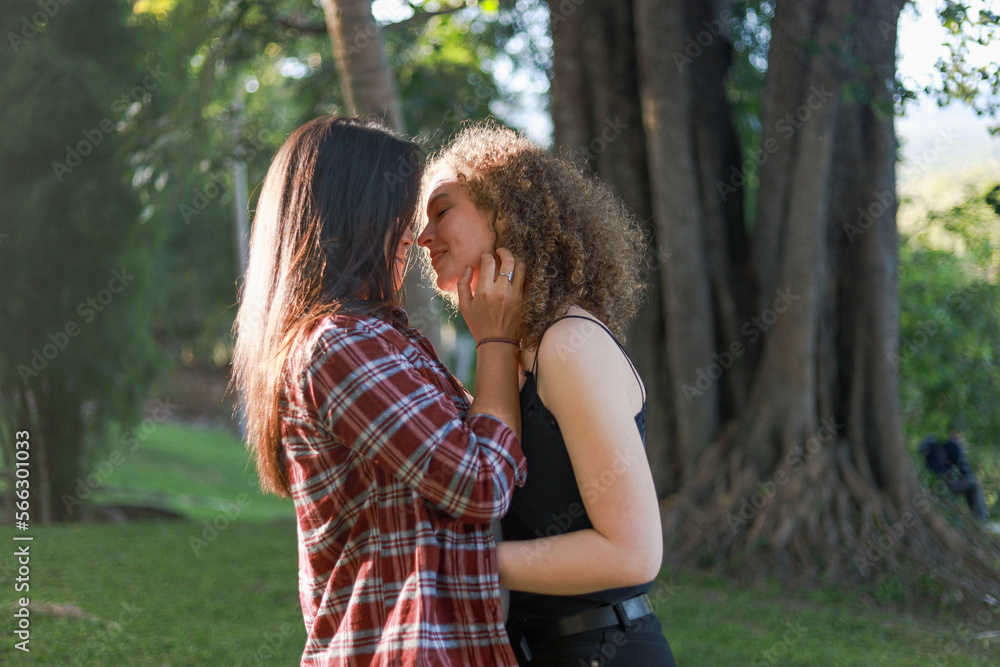 Beautiful women LGBT Lesbian Couple intimate moments. Young couple multiracial female friends. multi-ethnic female couple in love hug each other Beautiful women LGBT Lesbian Couple intimate moments. Young couple multiracial female friends. multi-ethnic female couple in love hug each other