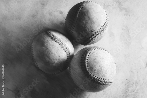 Artistic monochrome image of baseball balls in black and white, used from game.