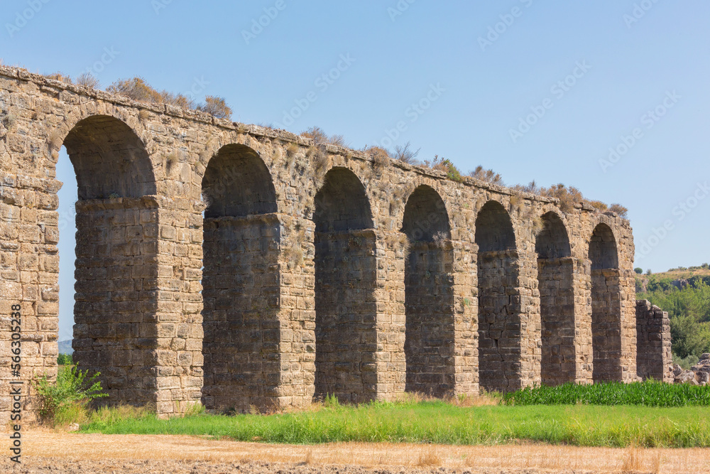 Roman aqueduct at Aspendos, part of water supply ancient system. Antalya region, Turkey (Turkiye). History and archaeology background