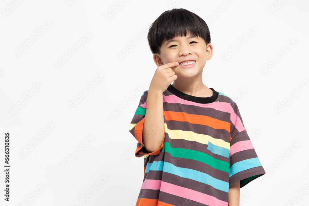Asian little boy point to teeth isolated on white background, Five years old, Dental health of preschoolers concepts Asian little boy point to teeth isolated on white background, Five years old, Dental health of preschoolers concepts