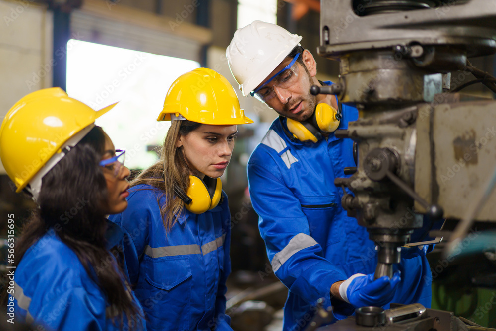 Team of mechanical engineer working together in the factory. Team of mechanical engineer working together in the factory.