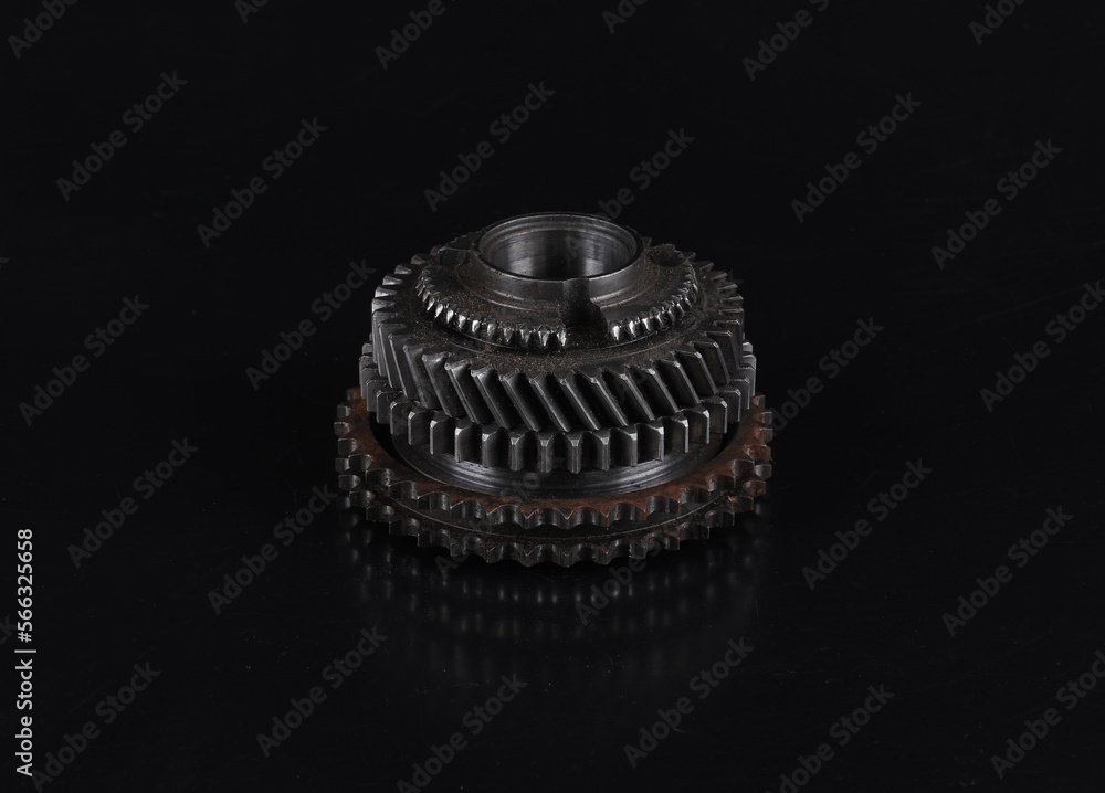 steel gear wheel of a car mechanism on a black background steel gear wheel of a car mechanism on a black background