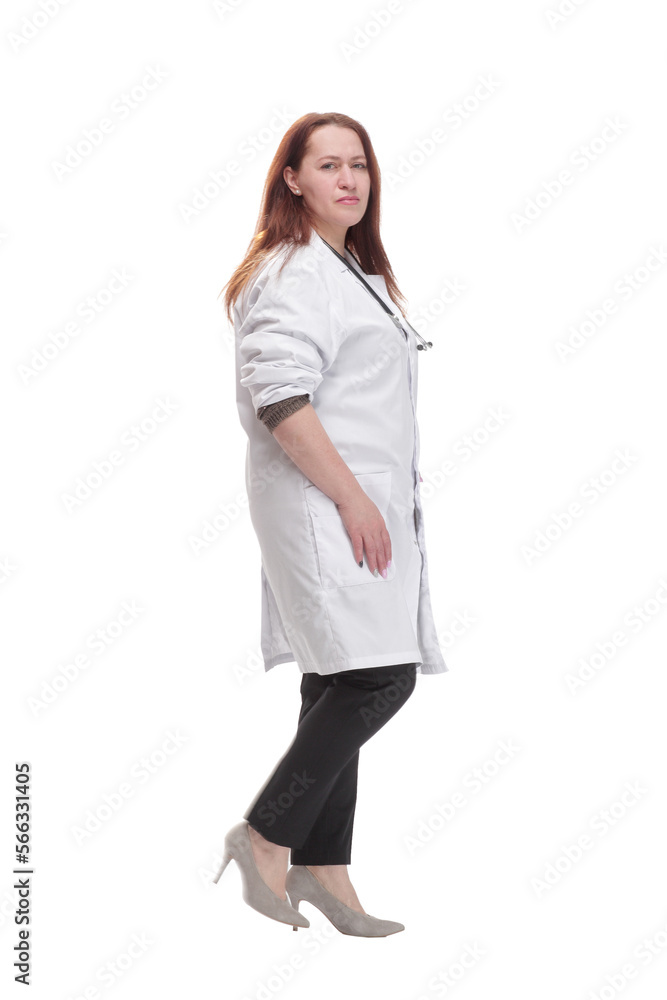 mature woman doctor striding forward. isolated on a white background. mature woman doctor striding forward. isolated on a white background.