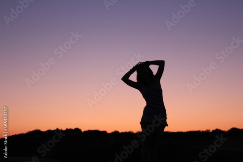 woman in a sunset on the beach