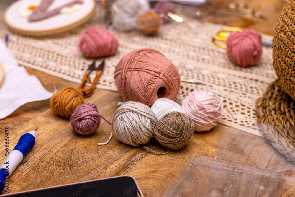 Different colored balls of wool for punch needle embroidery.