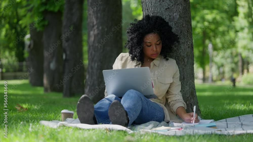 African American female student talking with tutor on laptop, online lesson African American female student talking with tutor on laptop, online lesson