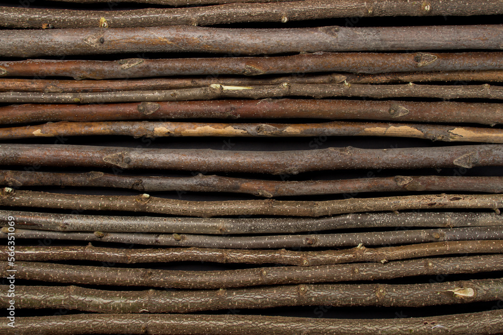 Rows of wooden branches as a background for the image